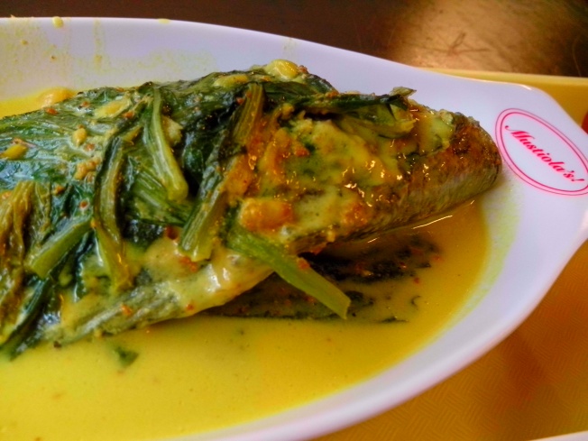 Fish wrapped in mustasa leaves.